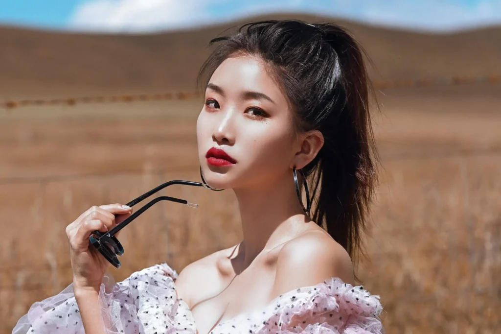 asian female model holding glasses