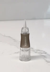 RealTint 1R PMU needle cartridge on marble for eyeliner and hair strokes training demonstration.