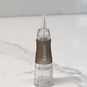 RealTint 1R PMU needle cartridge on marble for eyeliner and hair strokes training demonstration.