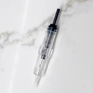 Polaris PMU needle cartridge on marble. Hyper Real Academy training demonstration for nano brows, hair strokes, and eyeliner.