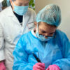 Hyper Real Academy PMU training. Student performing nano brows hair strokes demonstration with RealTint.