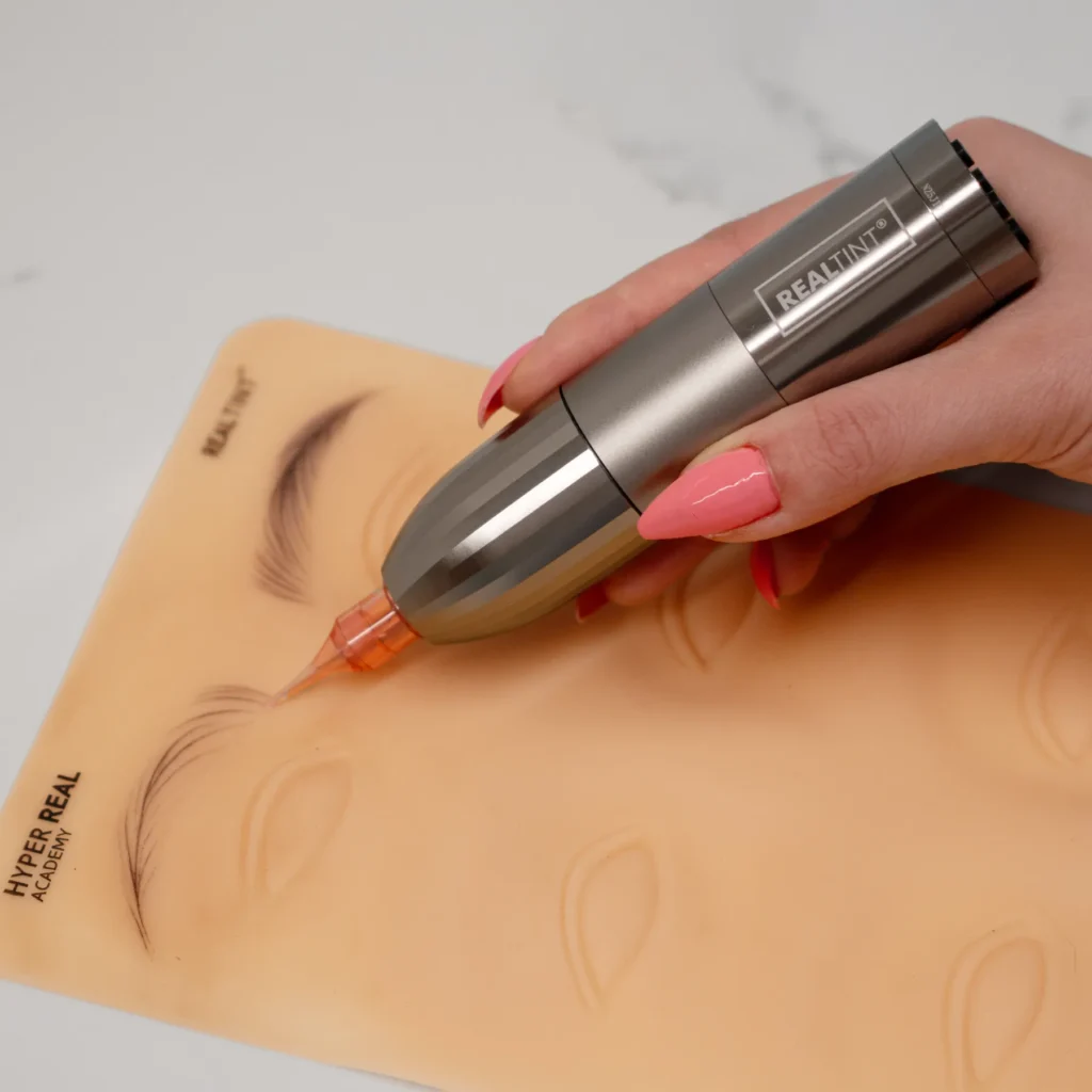 RealTint Nova Crystal needle demonstration on Hyper Real Academy pad for nano brows hair strokes PMU training.