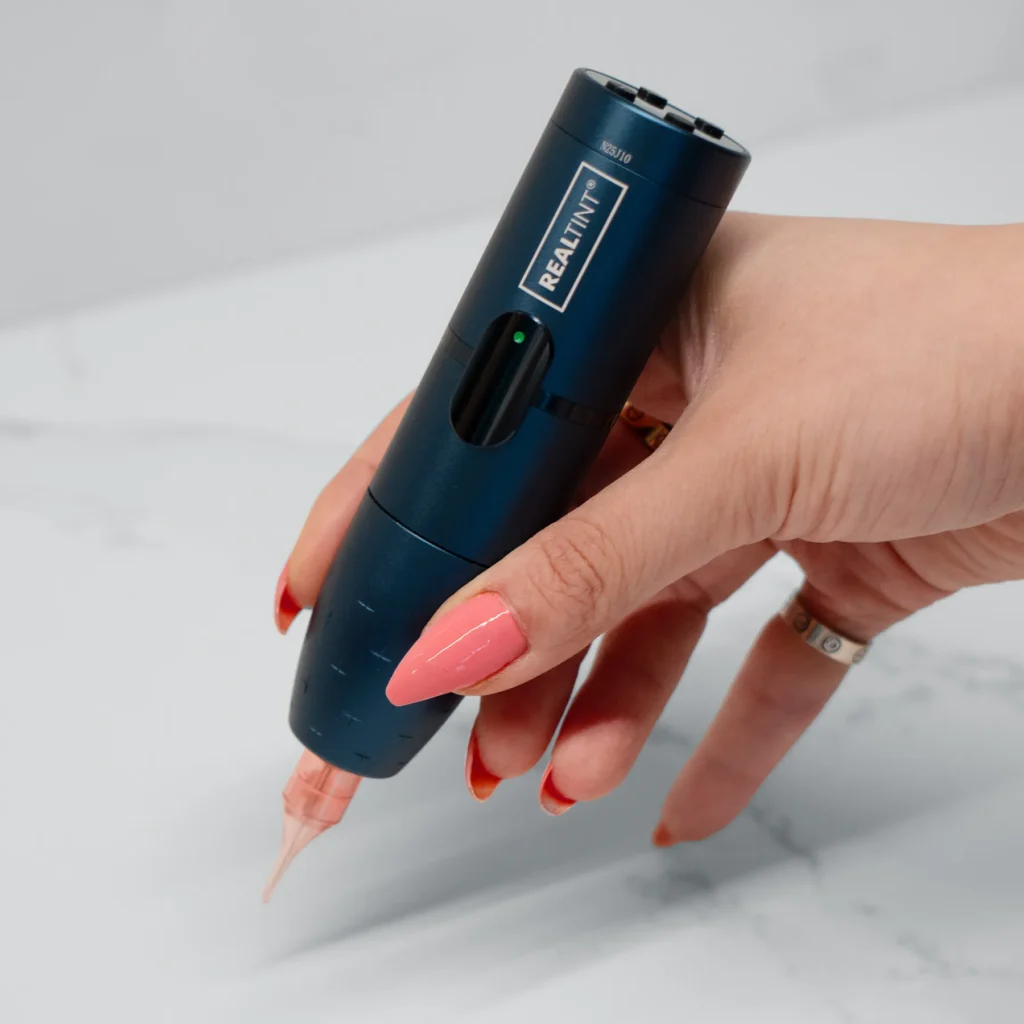Blue RealTint Nova PMU machine for permanent makeup training. Ideal for nano brows, eyeliner, lip blush, and SMP.