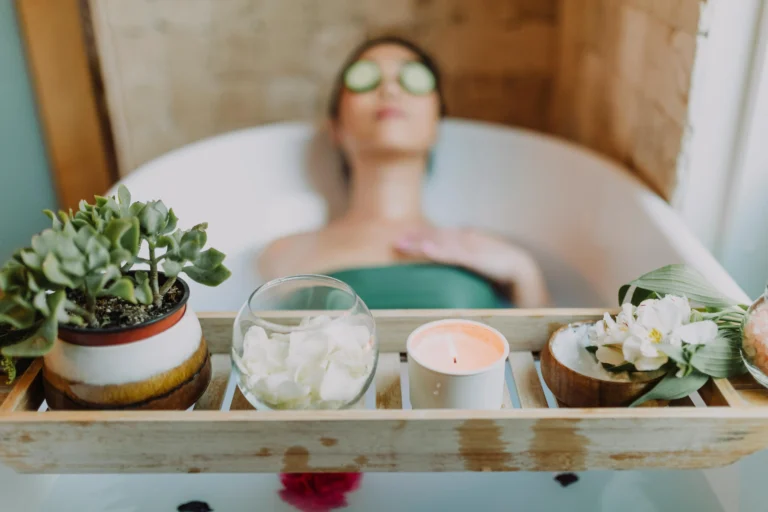 Woman in bath with cucumber slices and spa tray. Hyper Real Academy PMU training, nano brows, and lip blush demonstration.