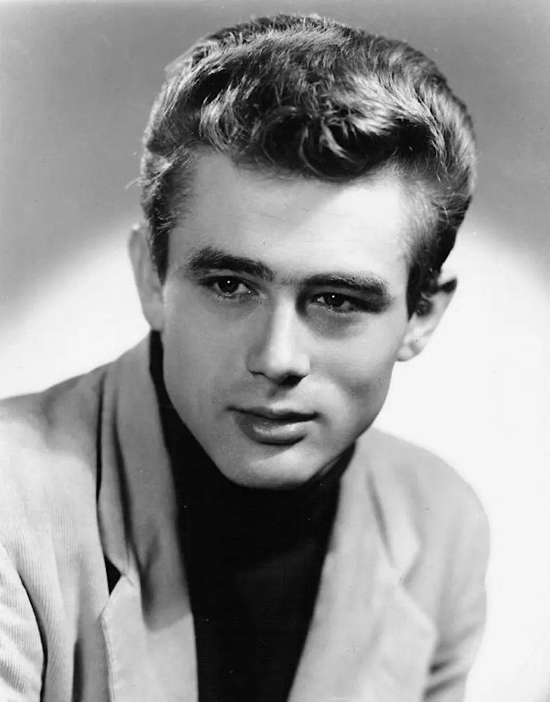 James Dean 1950s publicity photo: Classic black-and-white studio portrait of actor in turtleneck. Historical celebrity reference, not related to PMU.
