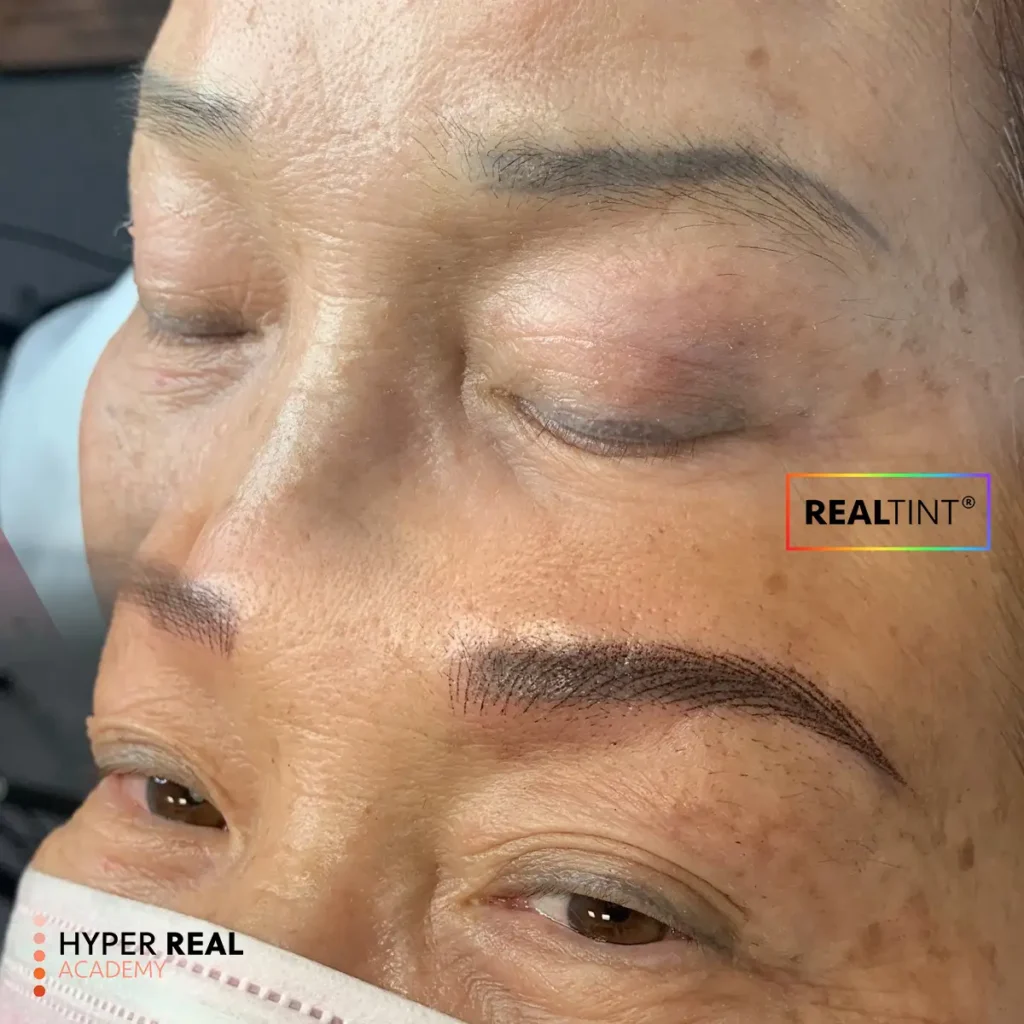 Promotional flyer for a Nano Brows One-Day Workshop by Hyper Real Academy in East Brunswick NJ. The image features a professional instructor in a white lab coat alongside close-up examples of PMU (Permanent Makeup) results, specifically showcasing natural hair-stroke nano brows and eyeliner. The flyer advertises training using RealTint® products, includes a certificate, and welcomes beginners and pros. Dates listed for July, August, and September 2026.