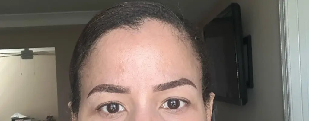 slightly misaligned eyebrows on a model